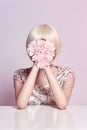 Fashion art portrait woman in summer dress and flowers in her hand with a bright contrasting makeup. Creative beauty photo girls Royalty Free Stock Photo