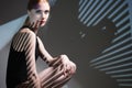 Fashion art studio portrait of elegant naked lady with shadow on her body Royalty Free Stock Photo