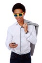 Fashion asian man in sunglasses using smarthone Royalty Free Stock Photo