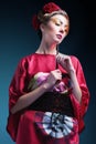 Fashion asian woman wearing traditional japanese red kimono. Geisha Royalty Free Stock Photo