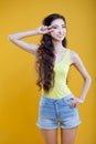 Fashion asian young girl. Portrait on yellow Royalty Free Stock Photo