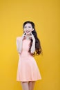 Fashion asian young girl. Portrait on yellow Royalty Free Stock Photo