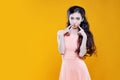 Fashion asian young girl. Portrait on yellow background. Royalty Free Stock Photo