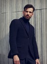 Fashion beard style business handsome male model posing in style clothing blue jacket and trousers on street wall outdoors Royalty Free Stock Photo