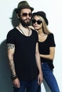 Fashion beautiful couple in hat together. Hipster boy and girl Royalty Free Stock Photo