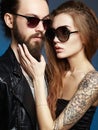 Bearded man and tattoed girl in love Royalty Free Stock Photo