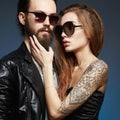 Bearded man and tattoed girl in love Royalty Free Stock Photo