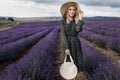 Fashion beautiful model in lavender field in sunset Royalty Free Stock Photo