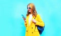 Fashion beautiful smiling woman using smartphone Royalty Free Stock Photo