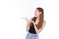 Fashion of a beautiful young asian woman in a pretty black vest and blue jeans feeling smile and happy. Girl pointing up with Royalty Free Stock Photo