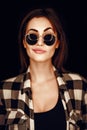 Fashion beauty girl wearing sunglasses, plaid shirt.