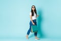 Fashion, beauty and lifestyle concept. Dreamy and happy asian girl enjoying shopping in mall, looking away cheerfully Royalty Free Stock Photo