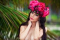 Fashion beauty portrait of beautiful brunette girl with wreath of flowers on her head Royalty Free Stock Photo