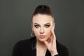 Fashion beauty portrait of pretty woman with makeup. Beautiful face with dark green smokey eyes makeup on black background Royalty Free Stock Photo