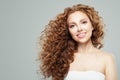 Fashion beauty portrait of young redhead woman with long healthy curly hair gray background Royalty Free Stock Photo