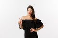 Fashion and beauty. Sassy woman in black dress saying no, disagree and shaking finger displeased, rejecting offer Royalty Free Stock Photo