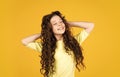 Fashion and beauty. small girl in hairdresser beauty salon. little happy kid has very curly hair. hairstyle for kids Royalty Free Stock Photo