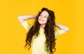 Fashion and beauty. small girl in hairdresser beauty salon. little happy kid has very curly hair. hairstyle for kids Royalty Free Stock Photo