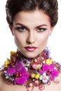 Fashion Beauty woman with flowers in her hair and around her neck. Perfect Creative Make up and Hair Style.