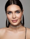 Fashion Beauty Woman Portrait with Silver Jewelry Earrings and Necklace. Glamour Model with Perfect Make up and Smooth Face Skin