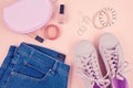 Fashion blog or magazine concept. Pink female sneakers, jeans an