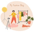 Fashion blogger. Stylist advises and selects clothes for client. Influencer records vlog. Young woman is recording video