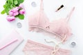 Woman elegant pink lace bra and panties, pumps and jewelry. Stylish lingerie flat lay.