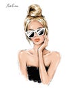 Fashion blond hair girl in sunglasses. Beautiful woman face. Fashion woman with hair bun.