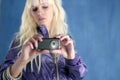 Fashion blonde girl photo camera mobile phone