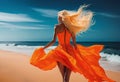 fashion blonde in orange fluo dress walking on the beach