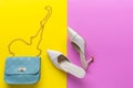 Fashion blue bag and white shoes woman accessories on  pastel color background. Royalty Free Stock Photo