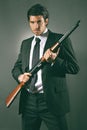 Fashion bodyguard poses with shotgun Royalty Free Stock Photo