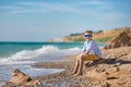 Fashion boy on the beach Royalty Free Stock Photo