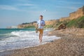 Fashion boy on the beach Royalty Free Stock Photo