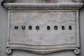Hugo Boss luxury fashion brand logo on an ancient building in Florence Italy Royalty Free Stock Photo