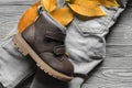 Fashion brown leather kids shoe and denim pants and accessories. Royalty Free Stock Photo