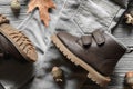 Fashion brown leather kids shoes, denim pants and accessories. a Royalty Free Stock Photo