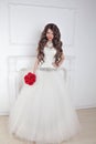 Fashion brunette bride in wedding dress posing over modern deco