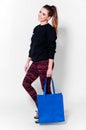 Fashion brunette woman with bag
