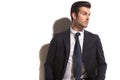 Fashion business man looking over shoulder to his side Royalty Free Stock Photo