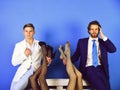 Fashion and business, men holding female legs, luxury and patriarchy Royalty Free Stock Photo