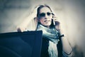 Fashion business woman in sunglasses calling on cell phone next to car Royalty Free Stock Photo
