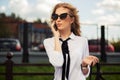 Fashion business woman in sunglasses calling on mobile phone Royalty Free Stock Photo