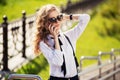 Fashion business woman in sunglasses calling on mobile phone Royalty Free Stock Photo