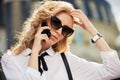 Fashion business woman in sunglasses calling on mobile phone Royalty Free Stock Photo