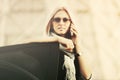 Fashion business woman in sunglasses calling on phone next to car Royalty Free Stock Photo