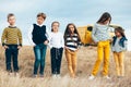 Fashion children in autumn field Royalty Free Stock Photo