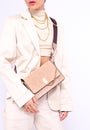 Fashion City Lady. Stylish Details Of Everyday Outfit. Casual Beige Aesthetics.Trendy Accessories Velvet Clutch And Chaine.