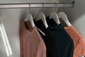 Fashion clothes hang on a hanger. Hangers with garment. Royalty Free Stock Photo