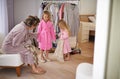 Fashion, clothes and mother with kids in wardrobe for makeover, getting dressed and choose outfit. Family, home and mom Royalty Free Stock Photo